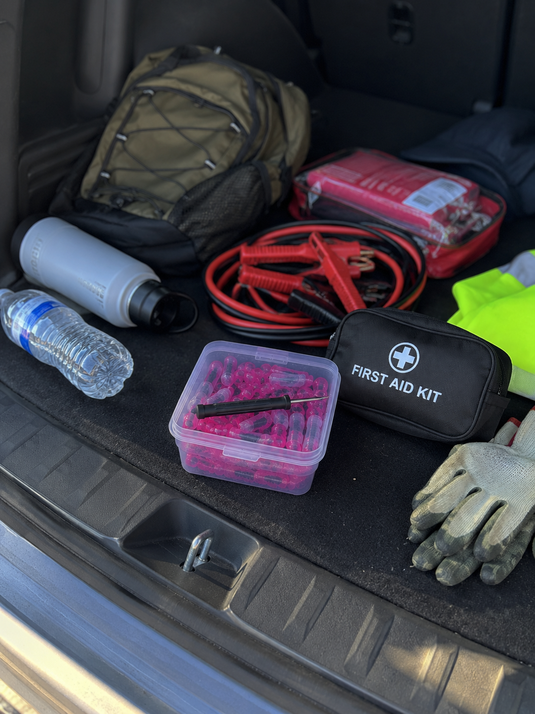 Tire plug kit stored in vehicle trunk